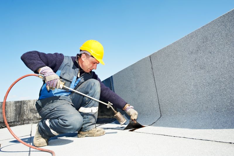 Skilled roofing workers at work